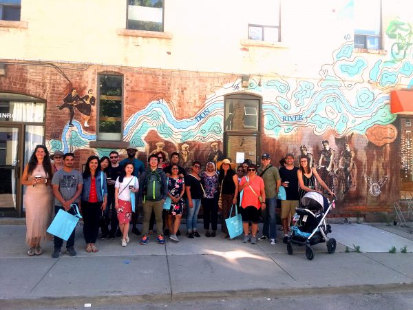 Riverside Coffee Culture Walk, stopping for a fun photo with the Riverside Sports History & Legacy Mural on Munro St